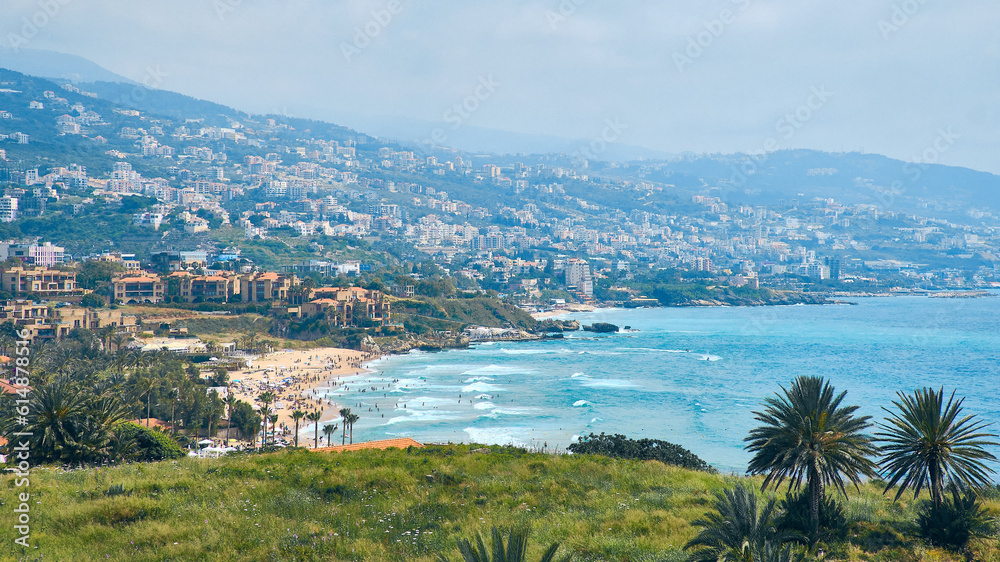 Splashing waves on Byblos beach. View of Jbeil Mediterranean coastline, Lebanon