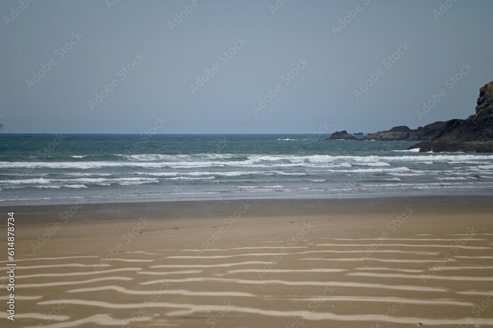The waves at Canon Beach in Oregon have left ripples in the sandy beach The waves at Canon Beach in Oregon have left ripples in the sandy beach