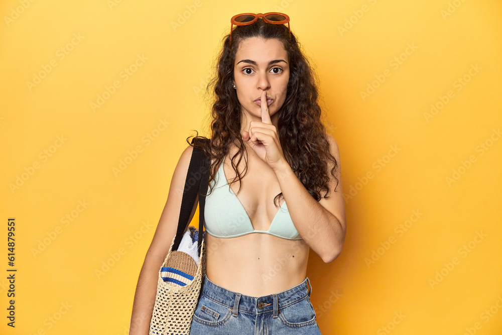 Woman in summer look, bikini, beach essentials, keeping a secret or asking for silence. Woman in summer look, bikini, beach essentials, keeping a secret or asking for silence.
