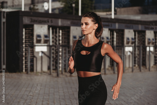 Beautiful young fit tanned caucasian woman running © Iryna