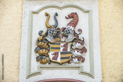 Relief Wappen mit Ritterhelm und Löwenkopf mit Stuckrahmen an Hauswand in Bräunlingen photo