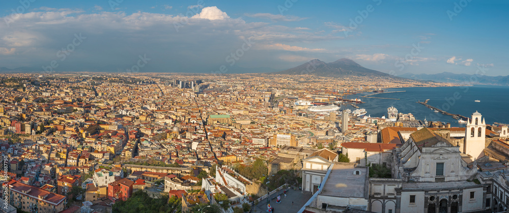 The panorama of Naples in the evening light.	
