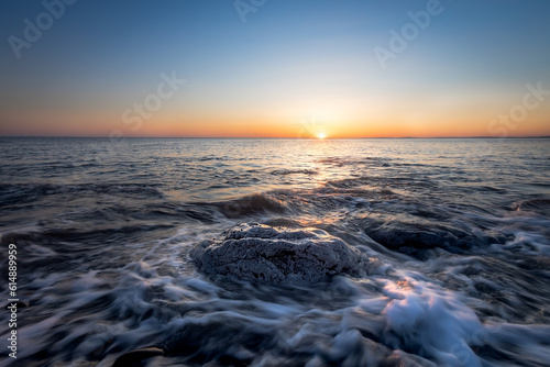 Consummation of a day at sea by sunset