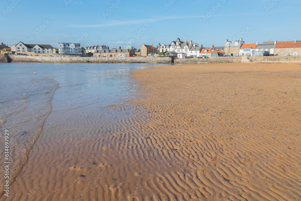 Sandy beach and shoreline at low tide in the seaside coastal village of Elie, East Neuk, Fife, Scotland, UK. Sandy beach and shoreline at low tide in the seaside coastal village of Elie, East Neuk, Fife, Scotland, UK.