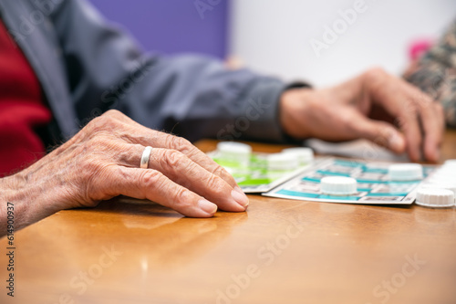 Close up of a senior man playing bingo at Nursing home. leisure game, support, assisted living, and retirement. High quality photo