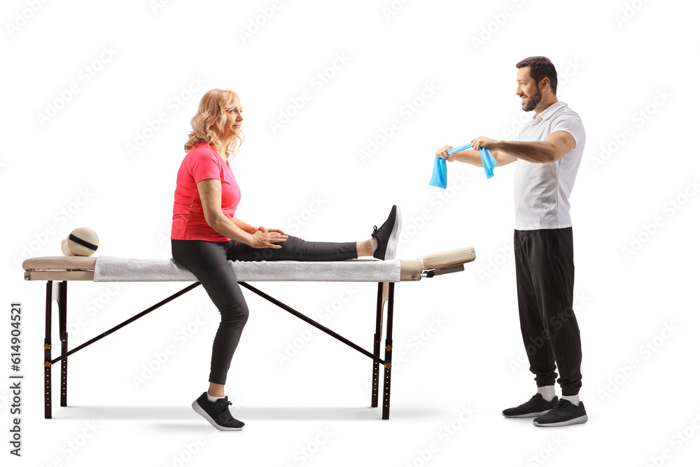 Woman sitting and a physical therapist showing exercises with a resistance band