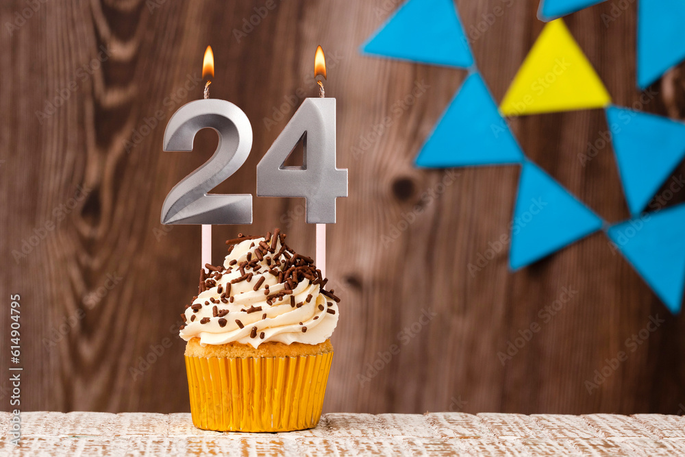 Birthday card with candle number 24 - Wooden background with pennants
