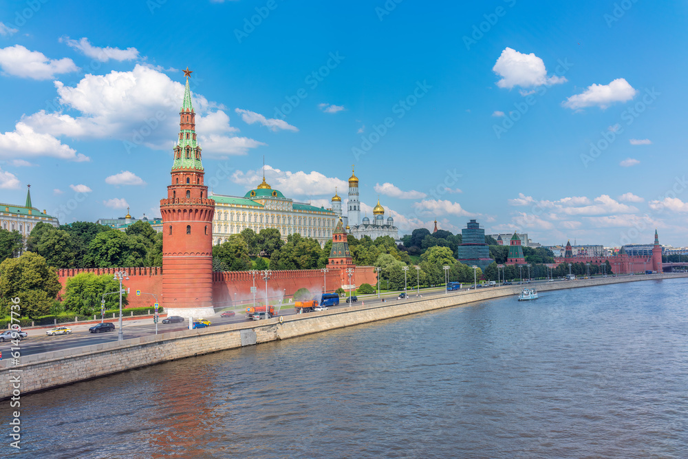 View of Kremlin with Vodovzvodnaya tower, Grand Kremlin Palace from repaired Bolshoy Kamenny Bridgein Moscow city on sunny summer day