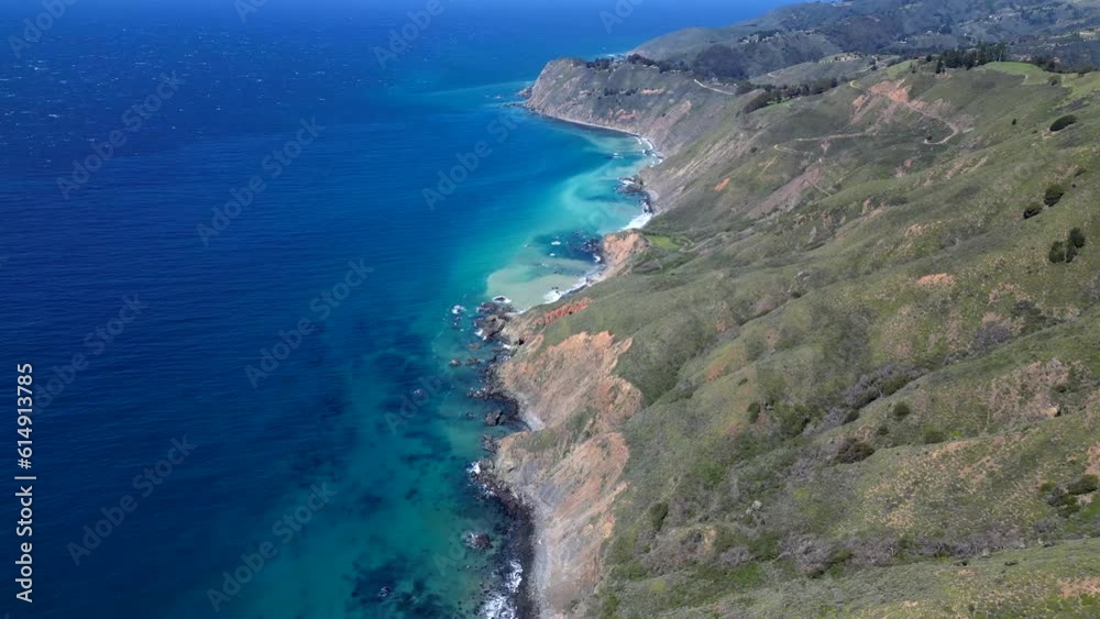 Aerial video view of coatline with mountains and ocean Aerial video view of coatline with mountains and ocean