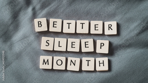 Better sleep month. Better sleep month words on soft bed. High angle view. Selective focus included. Presentation template.