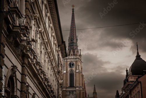 The Name of Mary Church, also known as Novi Sad catholic cathedral or crkva imena marijinog during a cloudy sunset dusk. This cathedral is one of the most important landmarks of Novi Sad, Serbia. photo
