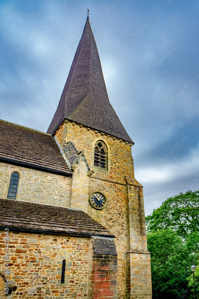 Church steeple with clock in England