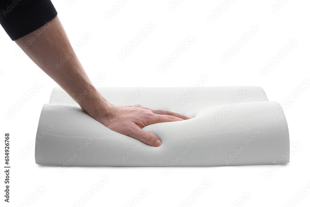 Fototapeta premium Man touching orthopedic memory foam pillow on white background, closeup