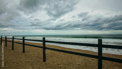 storm over the sea, fence and water, time lapse video