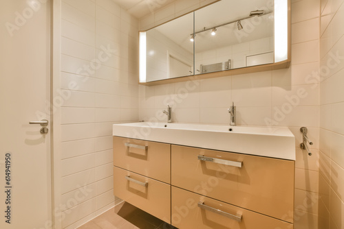 a bathroom with two sinks and mirror above the sink is not in use, but it's very clean