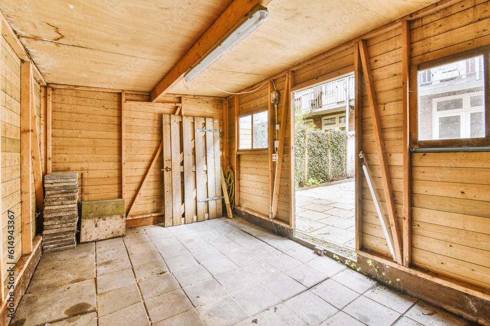 Fototapeta premium an empty room with wooden walls and wood trim around the door, which has been stripped down to make way for new flooring