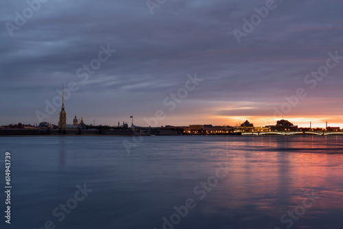 View of the Peter and Paul Fortress and the Neva River against a pink dawn sky with clouds on a sunny spring morning, St. Petersburg, Russia © Ula Ulachka