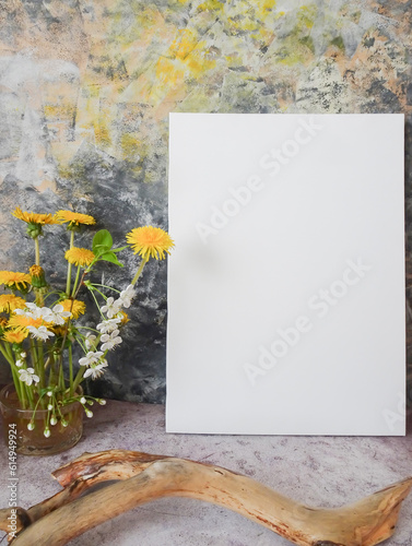 mockup picture next to a bouquet of flowers on a colorful background