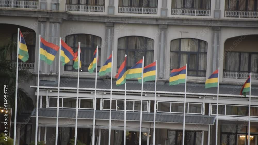Ebene, Mauritius - June 16, 2023: Multiple flags fluttering due to heavy wind