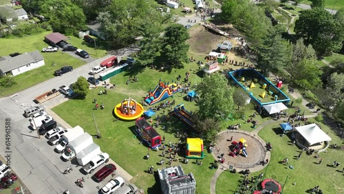 Hyperlapse aerial orbit of Dogwood Festival kids park bounce castle and attractions, Siloam Springs, Arkansas photo