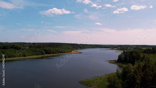 Peleci lake next to the small town of Preili. A lake at the edge of the forest photo