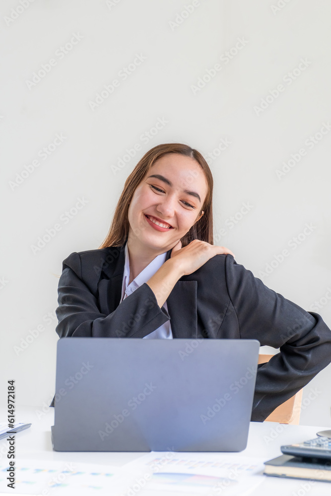 Young businesswoman feeling pain and stretch herself after working hard on computer laptop for a long time, Office syndrome concept Young businesswoman feeling pain and stretch herself after working hard on computer laptop for a long time, Office syndrome concept