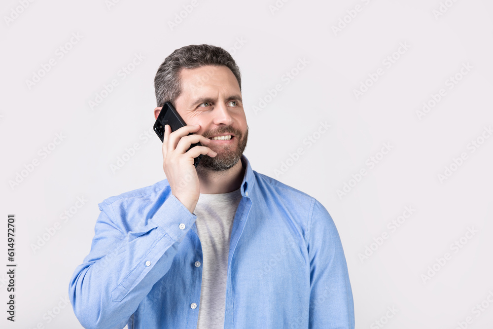 communication call of happy man. having communication call. man has communication call on phone isolated on studio background. man with communication call in studio. communication call of happy man. having communication call. man has communication call on phone isolated on studio background. man with communication call in studio.