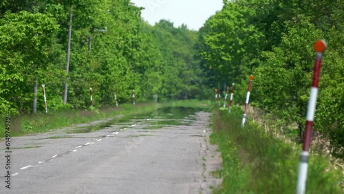 
Hokkaido, Japan - June 8, 2023: Road mirage or water mirage or inferior mirage on a road in Betsukai, Hokkaido, Japan
 photo