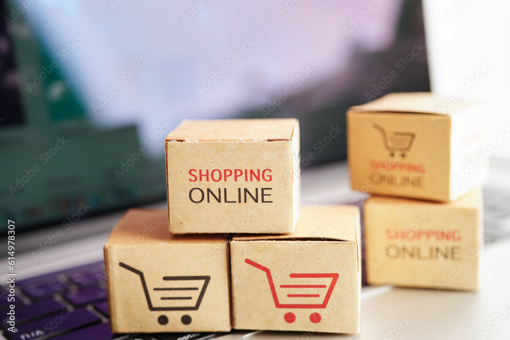 Online shopping, Shopping cart box on laptop with graph, import export, finance commerce. Online shopping, Shopping cart box on laptop with graph, import export, finance commerce.