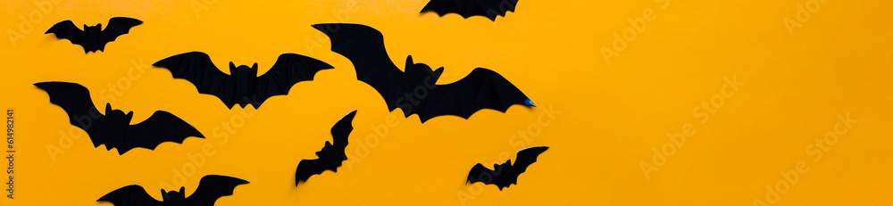 Fototapeta premium Banner Flat lay halloween. Bats pattern on orange background