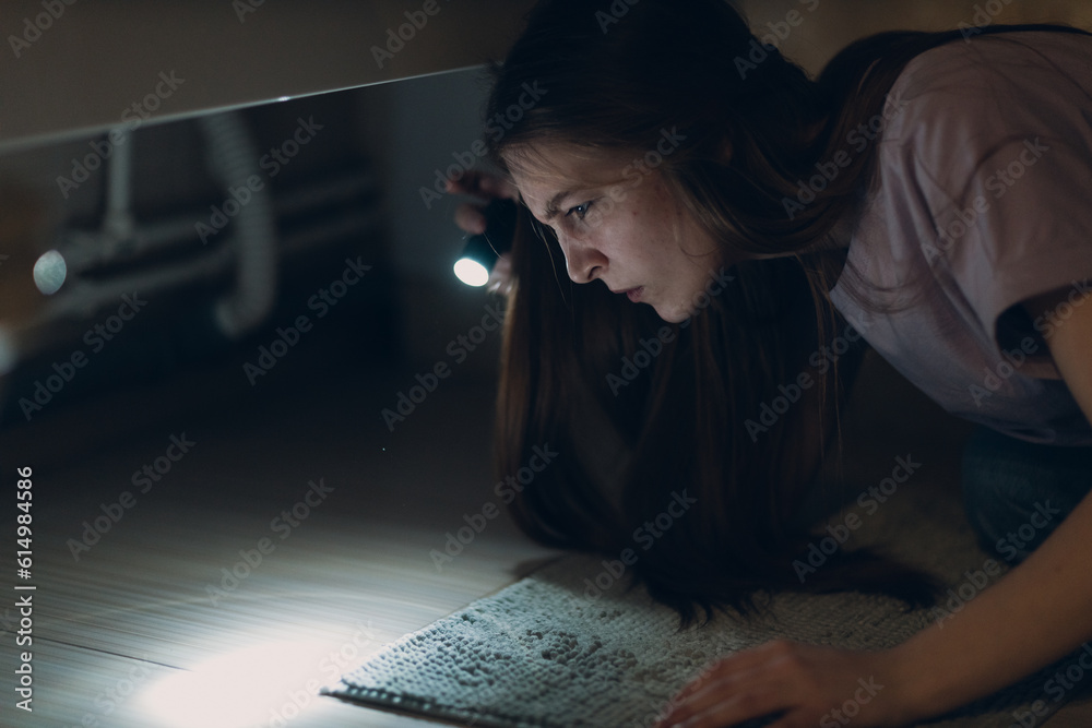 Woman young holding hand flashlight in darkness Woman young holding hand flashlight in darkness