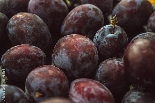 Fresh plums on the table, close-up