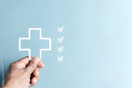 Fototapeta Naklejka Na Ścianę i Meble -  Health checkup and insurance concept. people hand holding plus and healthcare medical. health and access to welfare health concept..