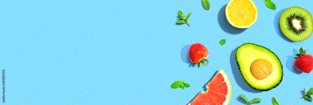 Avocado and mixed fruits overhead view flat lay Avocado and mixed fruits overhead view flat lay