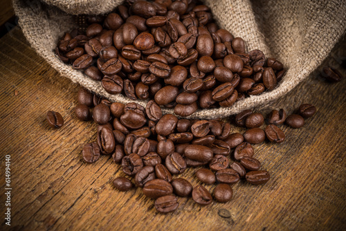 Coffee beans on grunge wooden background