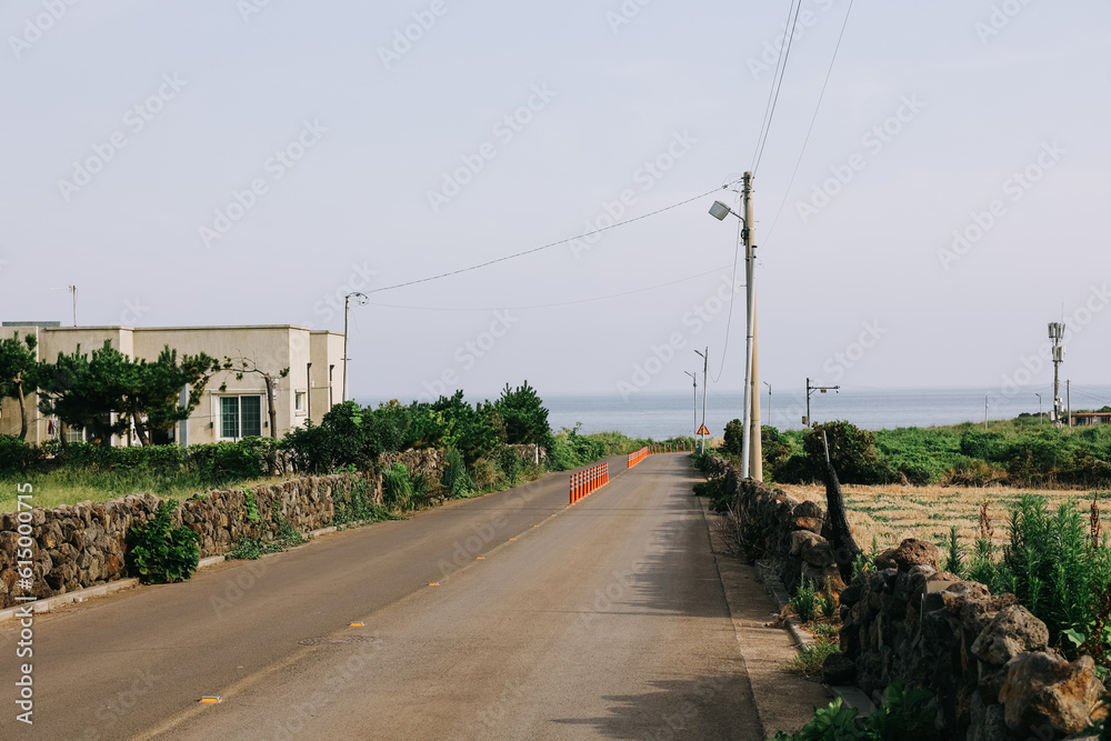 Jeju Island, South Korea - July 10, 2022: Street view of Jeju city in the morning. Jeju Island, South Korea - July 10, 2022: Street view of Jeju city in the morning.