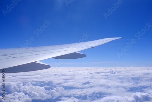 Close up Airplane Wing with Beautiful Blue Sky Background. © mesamong