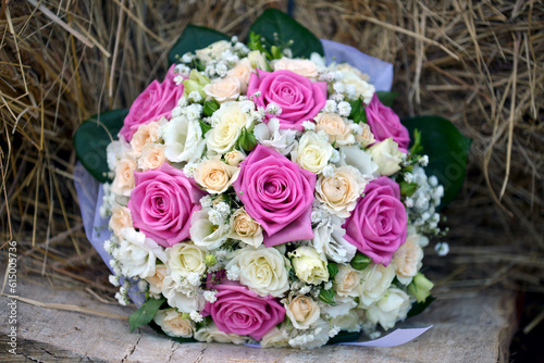 delicate bouquet of wedding flowers in the hay