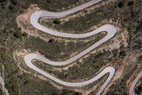 Drone point of view photograph with a winding mountain road in greek island Kefalonia