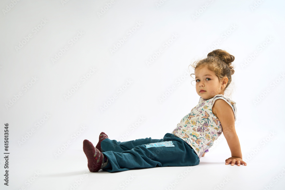 Portrait of Cute little girl with curly hairs on white background