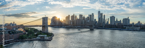 Brooklyn Bridge and Lower Manhattan sunset panorama, New York City, USA photo