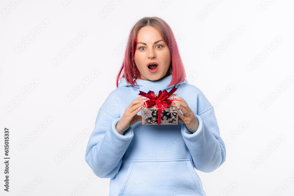 Holidays, celebration and women concept. Portrait of happy charismatic woman shaking gift box wondering what's inside as celebrating birthday, receive b-day presents, white background Holidays, celebration and women concept. Portrait of happy charismatic woman shaking gift box wondering what's inside as celebrating birthday, receive b-day presents, white background