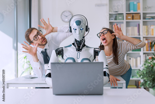 Office workers mocking their robot colleague