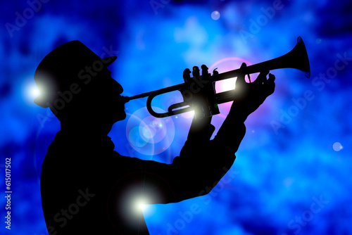 jazz trumpestist playing on stge photo