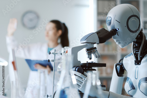 Scientist and robot working together in the lab