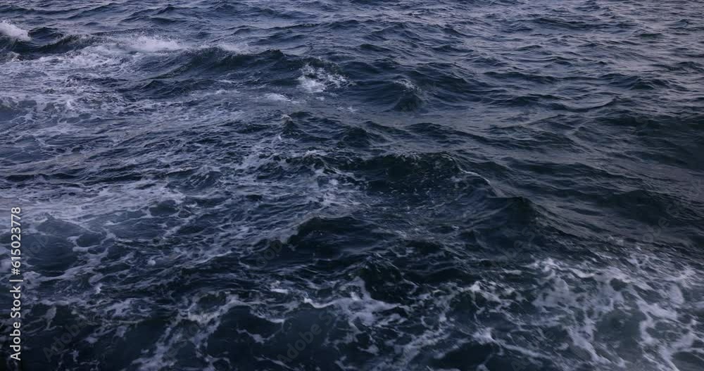 Amazing water background during storm. Waves sway on sea water and beautiful blue ocean water with waves