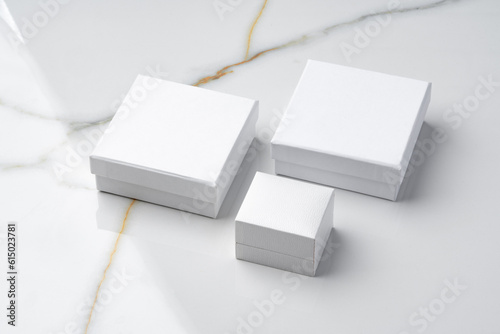 White jewelry box on a white marble background