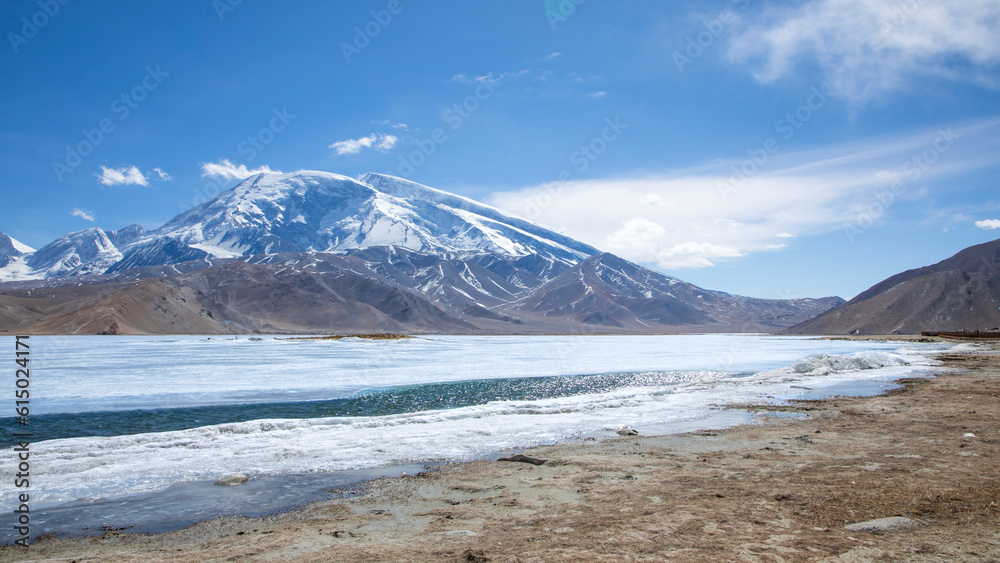 The bank of Karakul Lake under Muztagh Ata Peak