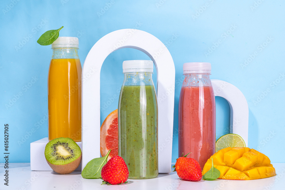 Colorful smoothies in glass bottles Colorful smoothies in glass bottles