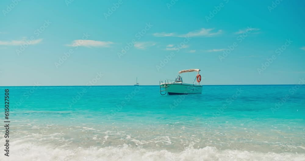 Motor Boat anchored off the beautiful beach Aegean sea, summer vacation concept